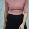 1164-1.png Women’s Pink Ribbed Half-Sleeve Top with Black Pleated Mini Skirt – Chic Contrast Casualwear Ensemble