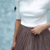 1164-2.png Women’s Pink Ribbed Half-Sleeve Top with Black Pleated Mini Skirt – Chic Contrast Casualwear Ensemble