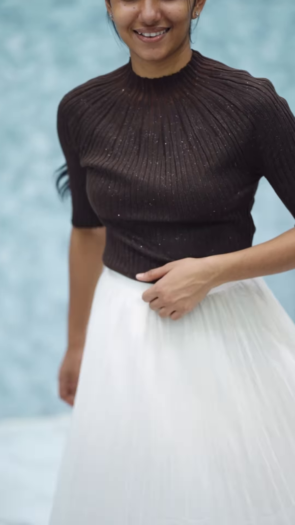 1164-4.png Women’s Pink Ribbed Half-Sleeve Top with Black Pleated Mini Skirt – Chic Contrast Casualwear Ensemble