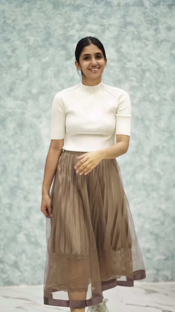 1164-8.png Women’s Pink Ribbed Half-Sleeve Top with Black Pleated Mini Skirt – Chic Contrast Casualwear Ensemble