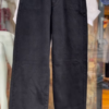 Women’s White Buttoned Crop Jacket with Striped Inner Top and Black Pants – Layered Streetwear Ensemble