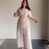 1193-3.png Women’s Green Floral Long Top with Black Wide-Leg Pants & Beige Sling Bag – Indo-Western Streetwear Ensemble for Everyday Styling