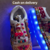 1197-2.png Unisex White Ethnic Mojari Footwear with Multicolor Bead Embroidery – Festive Pair with Red Light Showcase Styling