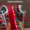1197-3.png Unisex White Ethnic Mojari Footwear with Multicolor Bead Embroidery – Festive Pair with Red Light Showcase Styling