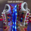 1197-4.png Unisex White Ethnic Mojari Footwear with Multicolor Bead Embroidery – Festive Pair with Red Light Showcase Styling