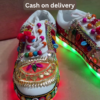 1197-5.png Unisex White Ethnic Mojari Footwear with Multicolor Bead Embroidery – Festive Pair with Red Light Showcase Styling