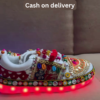 1197-8.png Unisex White Ethnic Mojari Footwear with Multicolor Bead Embroidery – Festive Pair with Red Light Showcase Styling