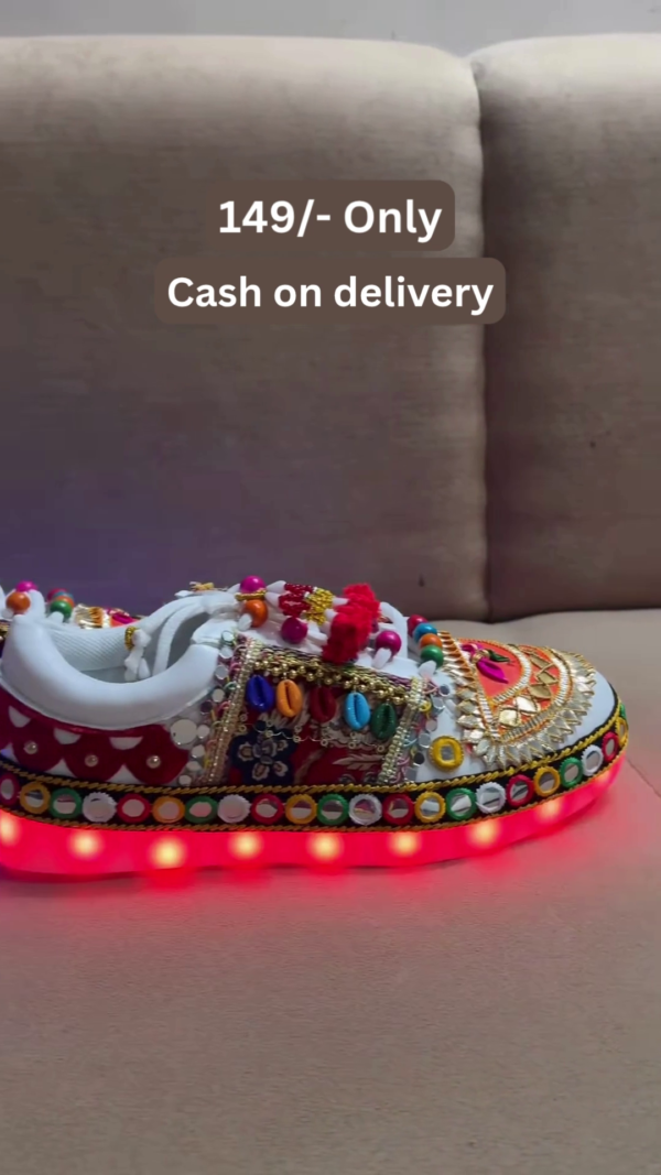 1197-8.png Unisex White Ethnic Mojari Footwear with Multicolor Bead Embroidery – Festive Pair with Red Light Showcase Styling