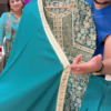 1199-1.png Women’s Teal Embroidered Long Kurti with Beige Floral & Paisley Motifs – Ethnicwear Portrait Piece for Seasonal Styling