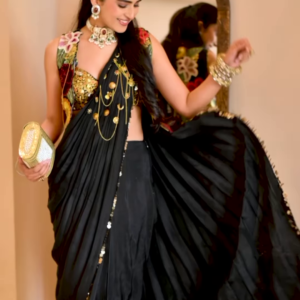 1204-7.png Women’s Black Saree with Gold Embellishments & Pleated Draping – Elegant Ethnicwear Styled with Traditional Bracelet