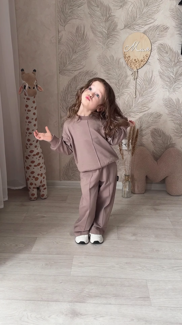 1207-3.png Kids’ Light Brown Co-Ord Set with Long Sleeves & White Sneakers – Neutral-Tone Outfit Styled with Giraffe Plush & Personalized Decor