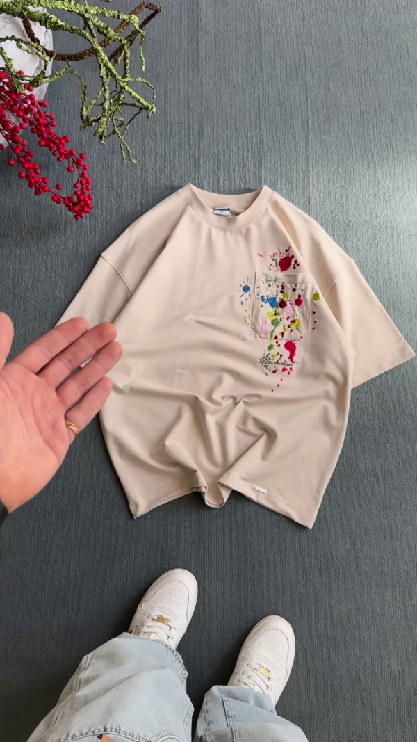 1209-5.png Unisex White & Beige T-Shirts with Colorful Paint Splatter and Pocket Embroidery – Artistic Casualwear for Everyday Styling