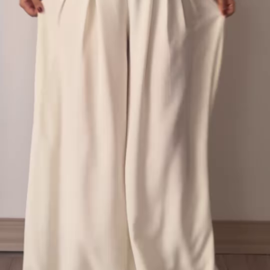 1210-5.png Women’s Beige Wide-Leg Pleated Pants with Drawstring Waist – Flowing Casualwear Styled with White Sneakers
